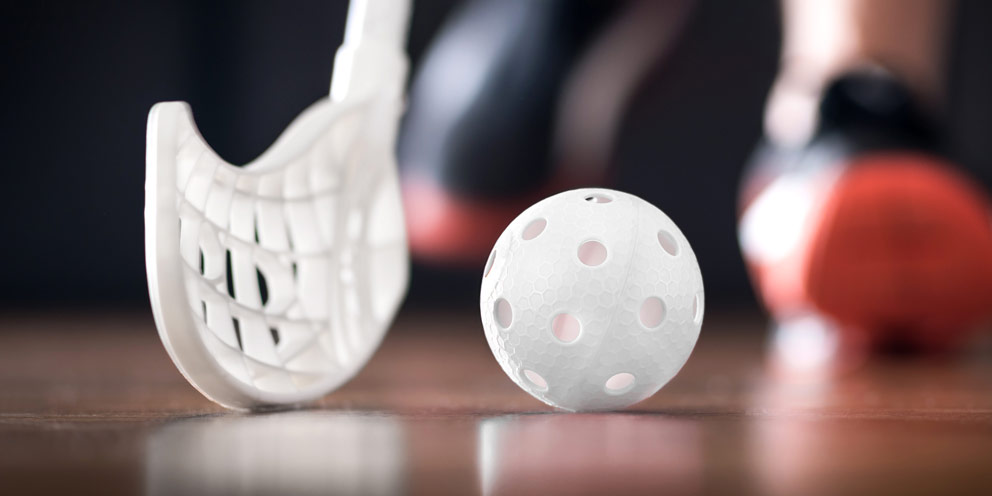 Floorball stick and ball